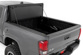 Rough Country Hard Tri-Fold Flip Up Bed Cover for 2016-2023 Toyota Tacoma