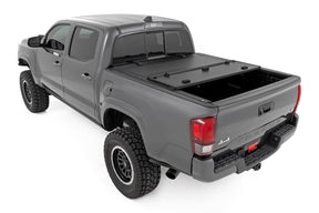 Rough Country Hard Tri-Fold Flip Up Bed Cover for 2016-2023 Toyota Tacoma
